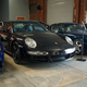 Black 911 inside a warehouse.